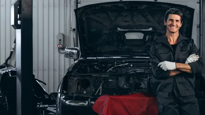 mechanic sitting in car